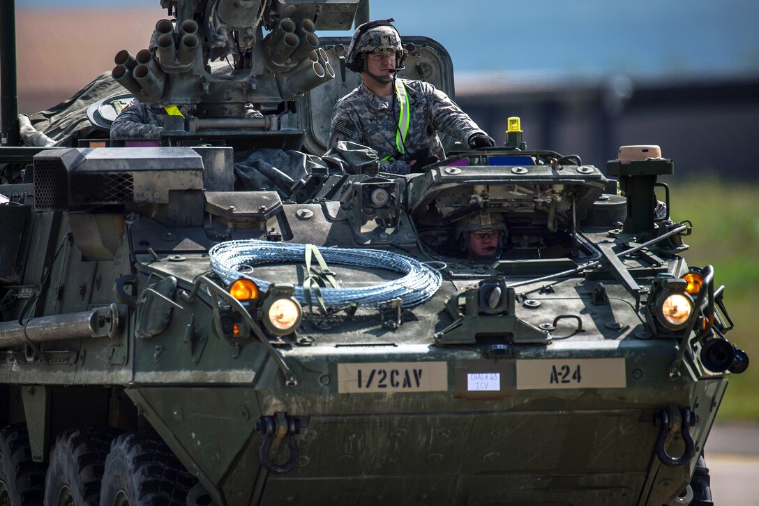 A U.S. Army Stryker infantry carrier vehicle convoys across the flightline during Steadfast Javelin II, a NATO exercise, on Ramstein Air Base, Germany, Sept. 3, 2014.