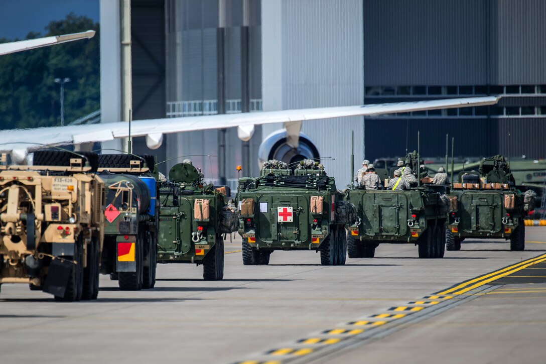 U.S. Army Stryker infantry carrier vehicles convoy across the flightline during Steadfast Javelin II, a NATO exercise, on Ramstein Air Base, Germany, Sept. 3, 2014.