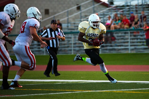 The 1st Light Armored Reconnaissance Battalion Highlanders claimed a hard-fought 20-14 victory over the Headquarters and Support Battalion Spartans at the Paige Fieldhouse football field here, Sept. 8.