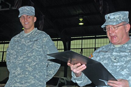 Pfc. Jordan Leskera of Edwardsville (left) smiles after reality sinks in and he realizes he has been accepted to West Point, a premier school for young Army Officers and the oldest military academy in the United States. Brig. Gen. Ronald Morrow (right), Assistant Adjutant General for the Illinois Army National Guard, read the acceptance letter in front of Leskera's Illinois Army National Guard peers and his family at a ceremony at the East St. Louis armory on Jan. 23.