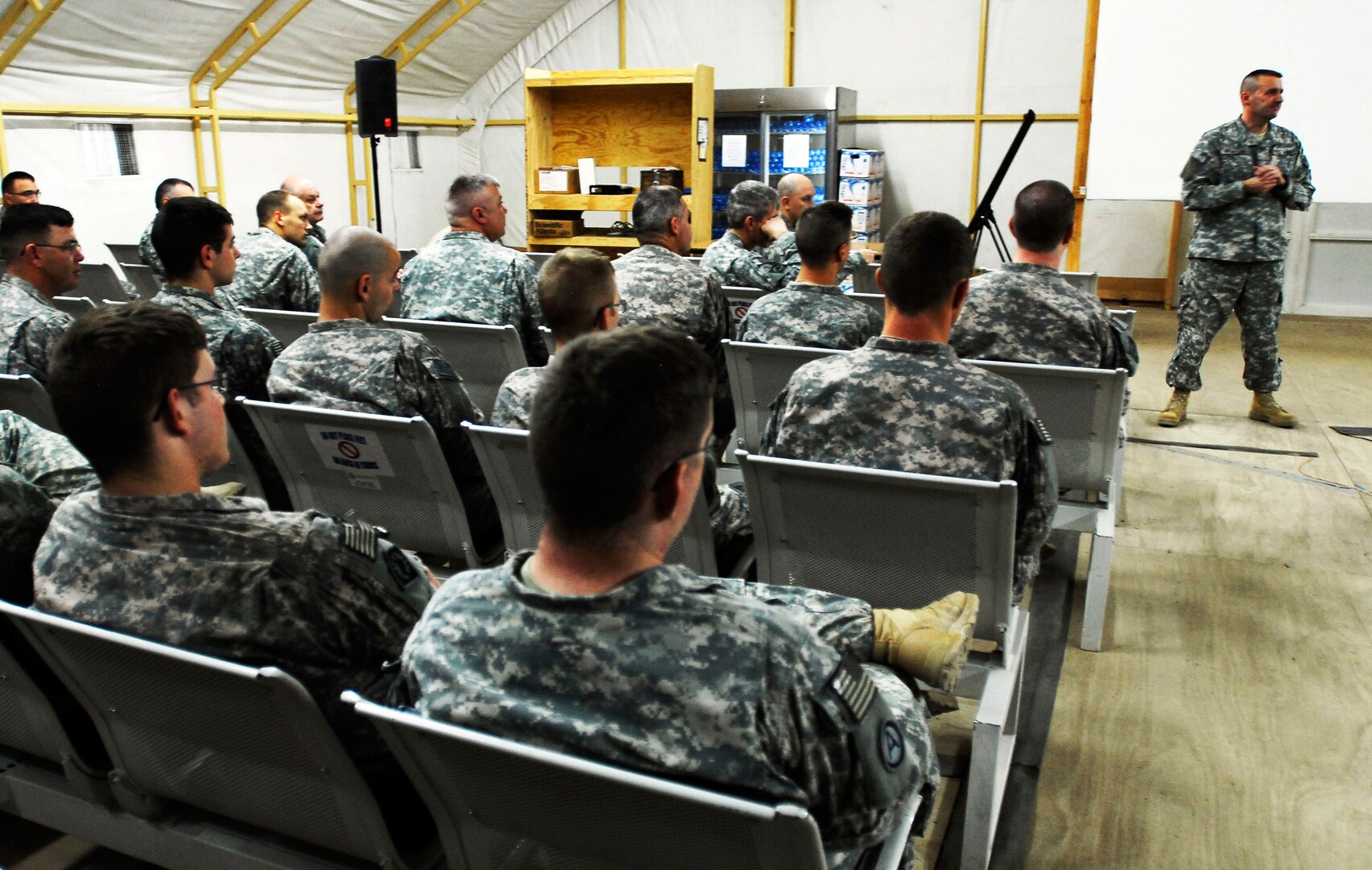 Wyoming Army National Guard Chief of Staff, Col. Greg Porter, briefs a group of Wyoming Soldiers about the current state of Wyoming and the road to demobilization during a visit to Camp Virginia, Kuwait, on Jan. 18, 2010. Porter was part of a small contingency of Wyoming National Guard Joint Force Headquarters staff who visited the brigade to ensure a successful reintegration process upon the unit's return this spring.