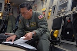 Senior Master Sgt. Elbert Emoto of the Hawaii Air National Guard's 154th Wing, prepares to depart with a C-17 Globemaster III from Hickam Air Force Base, Hawaii, Jan. 19, 2010, to Charleston AFB, S.C., to take part in humanitarian relief efforts in Haiti.