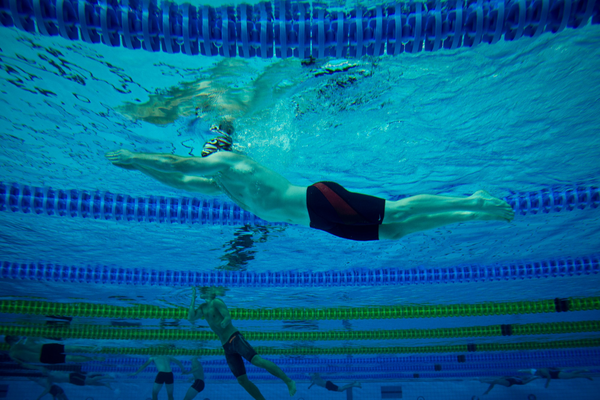 Retired Navy Lt. John Edmontson swims across the Aquatics Center competition pool during training for the inaugural 2014 Invictus Games Sept. 8, 2014, in London. The Invictus Games are an international Paralympic-style, multi-sport event designed for wounded service members. (U.S. Air Force photo/Staff Sgt. Andrew Lee)