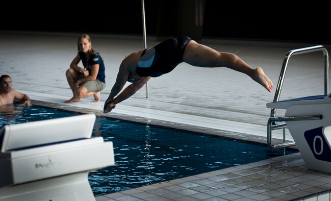 Retired Air Force Capt. Sarah Evans dives off the block during training at the Aquatics Center competition pool Sept. 8, 2014, in London. Evans said medals would be great, but she just wants to make her team, country and family proud during the first 2014 Invictus Games. (U.S. Air Force photo/Staff Sgt. Andrew Lee)