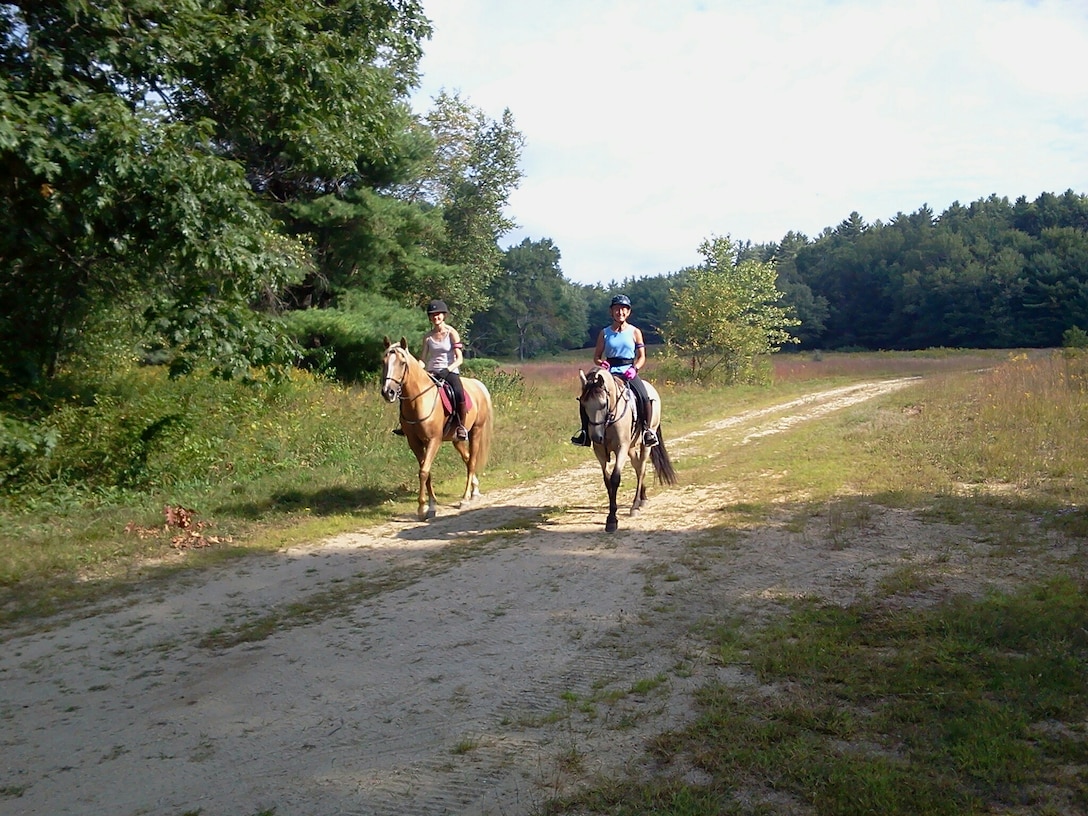 Two horseback riders take an mid-morning stroll at Birch Hill Dam, Royalston, Mass. The Birch Hill Dam property has more than 25 miles of roads and trails to enjoy hiking, pedaling, or horseback riding. 
