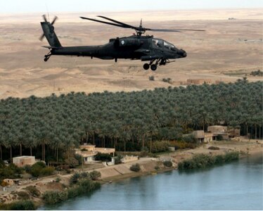An AH-64A Apache helicopter of the 1-149th Attack-Reconnaissance Battalion, Texas Army National Guard, conducts a “VIP” escort mission along the Euphrates River in Iraq on Thanksgiving Day 2006 during the unit’s deployment in support of Operation Iraqi Freedom.
