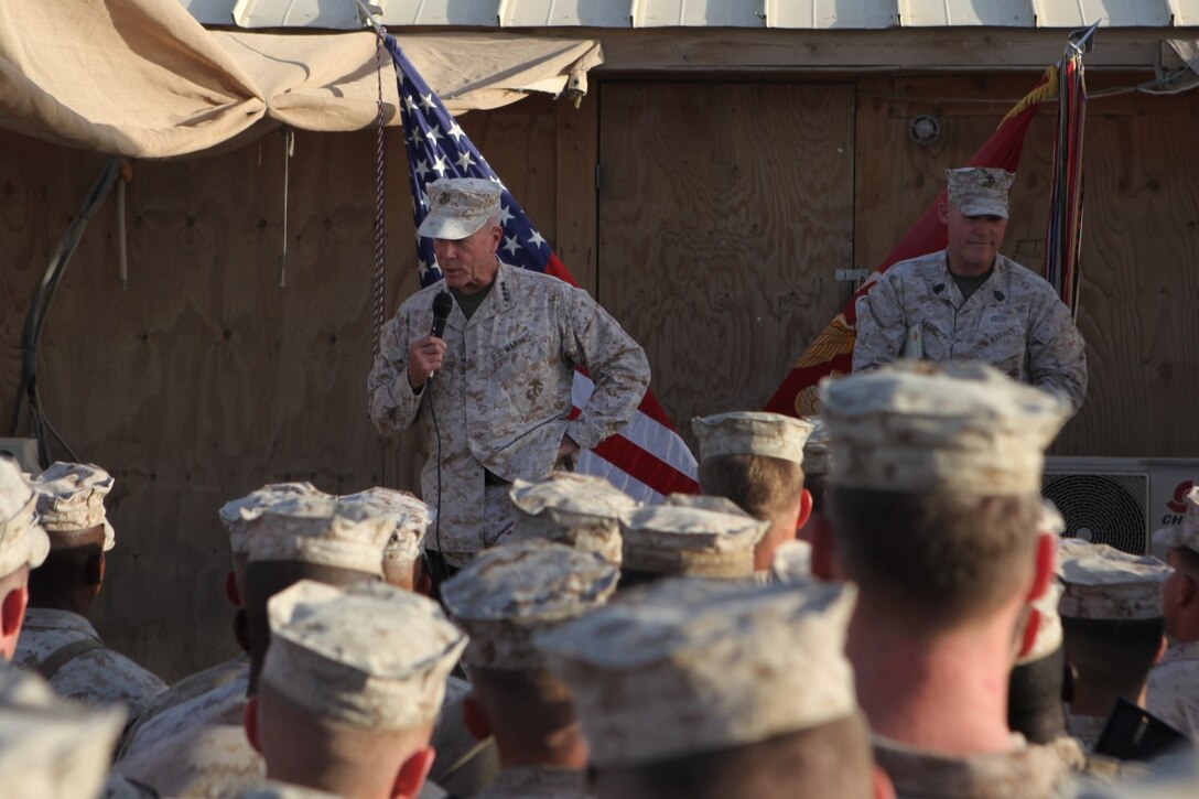 General James F. Amos, left, the 35th Commandant of the Marine Corps, and Sgt. Maj. Micheal Barrett, the 17th Sergeant Major of the Marine Corps, speak to Marines and sailors with 1st Battalion, 7th Marine Regiment; 1st Battalion, 2nd Marine Regiment; and 2nd Combat Engineer Battalion aboard Camp Leatherneck, Afghanistan, Sept. 6, 2014. Gen. Amos and Sgt. Maj. Barrett visited Marines and sailors serving with Marine Expeditionary Brigade – Afghanistan in Helmand province for the final time, thanking them for their service and sacrifice.