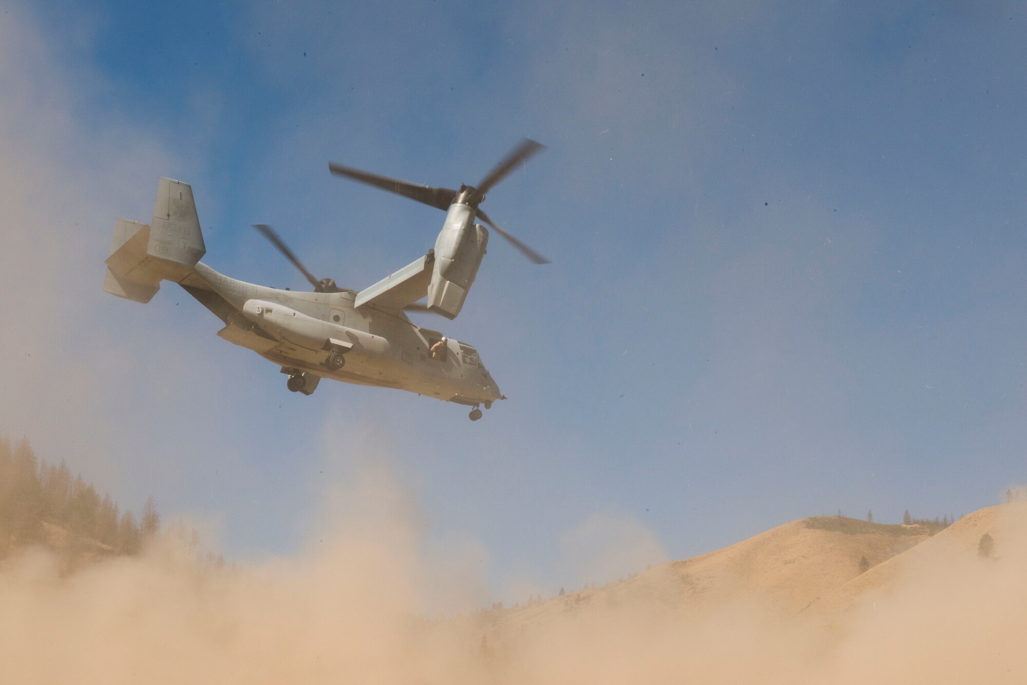 An MV-22B Osprey takes off to perform tactical maneuvers at the Saylor Creek Range Complex, near Mountain Home Air Force Base, Idaho, Sept. 9, 2014. The crew members are based out of the Marine Medium Tiltroter Squadron 161, 3rd Marine Aircraft Wing at Miramar, Calif. (U.S. Air Force photo by Airman 1st Class Malissa Lott/RELEASED