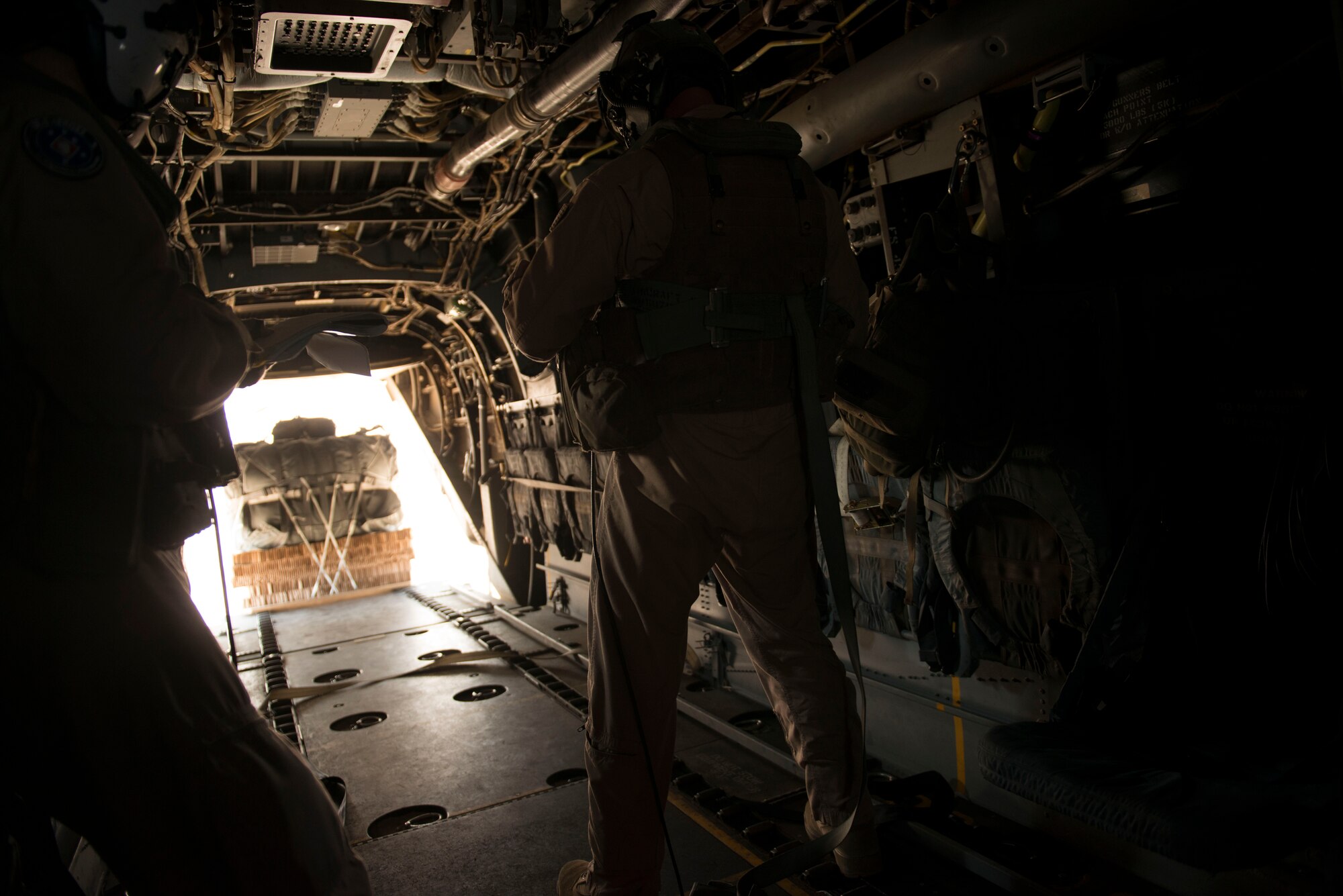 MV-22B Osprey crew members watch cargo drop at Saylor Creek Range Complex, near Mountain Home Air Force Base, Idaho, Sept. 9, 2014. The crew members are from the Marine Medium Tiltroter Squadron 161, 3rd Marine Aircraft Wing at Miramar, Calif. (U.S. Air Force photo by Airman 1st Class Malissa Lott/RELEASED)