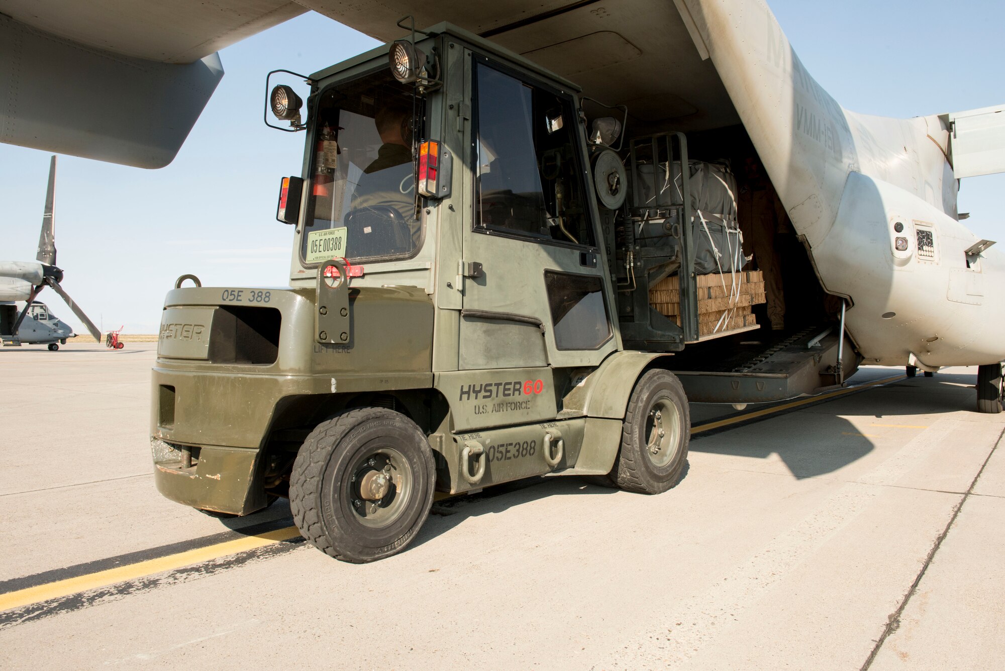 Before a mission, cargo is loaded on to a MV-22B Osprey at Mountain Home Air Force Base, Idaho, Sept. 9, 2014. The crew members are based out of the Marine Medium Tiltroter Squadron 161, 3rd Marine Aircraft Wing at Miramar, Calif. (U.S. Air Force photo by Airman 1st Class Malissa Lott/RELEASED)