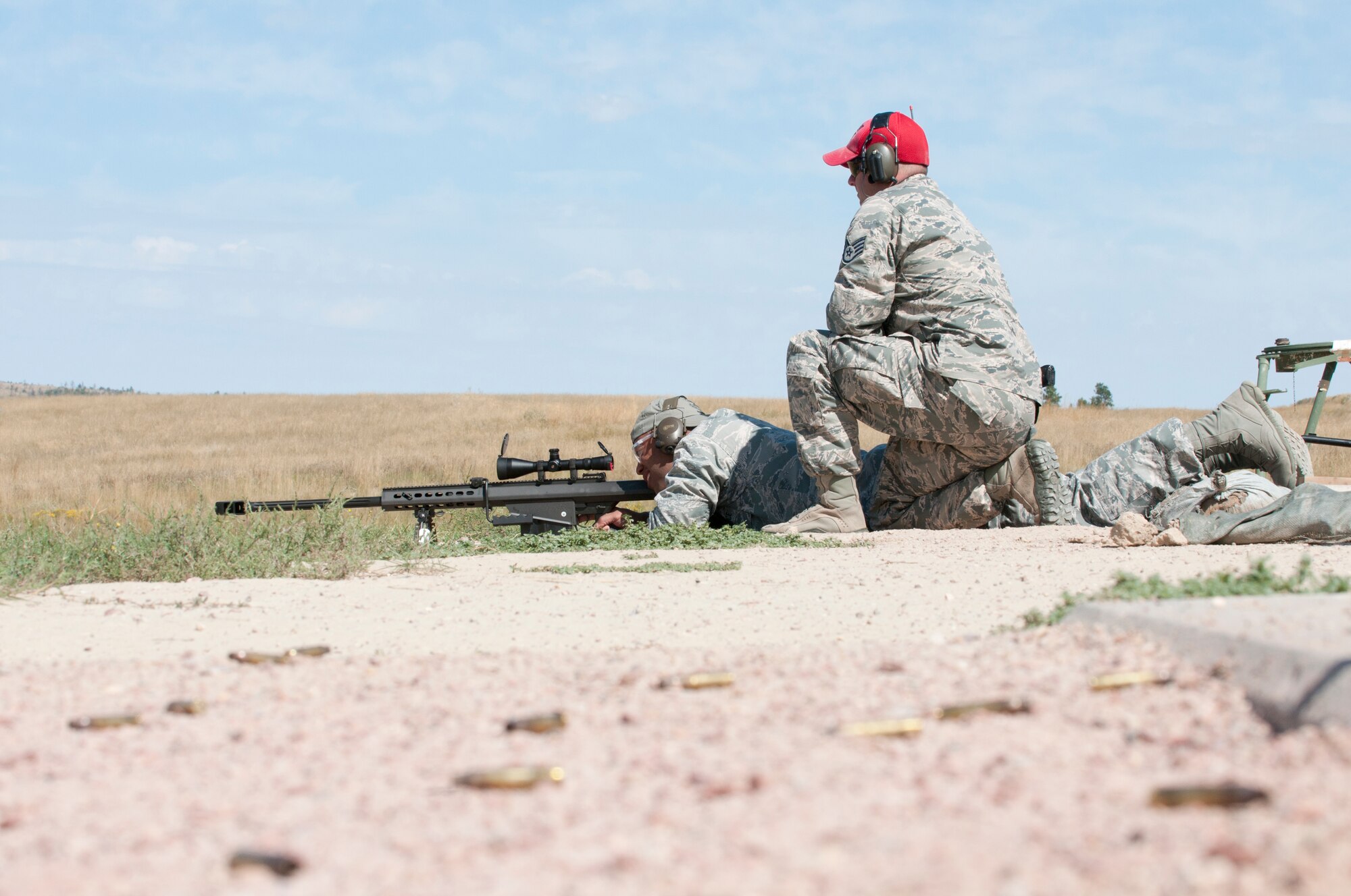Maj. Gen. Richard Clark, Air Force Global Strike Command vice commander, fires a M107 .50 cal. sniper rifle at a long distance range at Camp Guernsey, Wyo., Sept. 4, 2014. Clark visited the camp to become familiarized with the training capabilities offered at Camp Guernsey. (U.S. Air Force photo by Lan Kim)