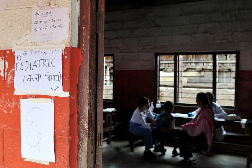 Dr. Seema Jilani, Project Hope pediatrician, examines a patient at a health services outreach site in Manahari, Nepal, Sept. 9, 2014, Operation Pacific Angel-Nepal. PACANGEL helps cultivate common bonds and foster goodwill between the U.S., Nepal and regional nations by conducting multilateral humanitarian assistance and civil military operations. (U.S. Air Force photo by Staff Sgt. Melissa B. White/Released)