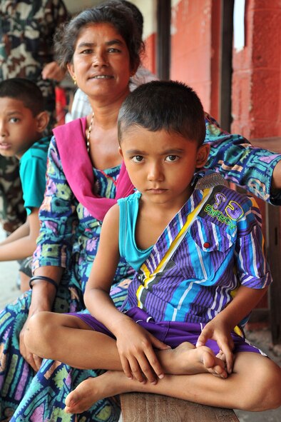A child waits to be seen by Operation Pacific Angel-Nepal pediatricians at a health services outreach site in Manahari, Nepal, Sept. 9, 2014. PACANGEL helps cultivate common bonds and foster goodwill between the U.S., Nepal and regional nations by conducting multilateral humanitarian assistance and civil military operations. (U.S. Air Force photo by Staff Sgt. Melissa B. White/Released)