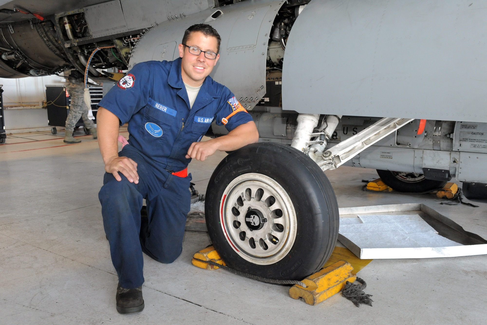 388th Aircraft Maintenance Squadron Crew Chief Staff Sgt. Ken Reber identifies the outer lock ring on an F-16 Fighting Falcon wheel. Reber noticed several wheels were missing the ring back in August. Landing the jets without the ring could have created potential separation and significant damage to the aircraft. Reber's attention to detail and willingness to go above and beyond earned him the August 2014 safety award for the 388th Fighter Wing (U.S. Air Force photo by Todd Cromar)