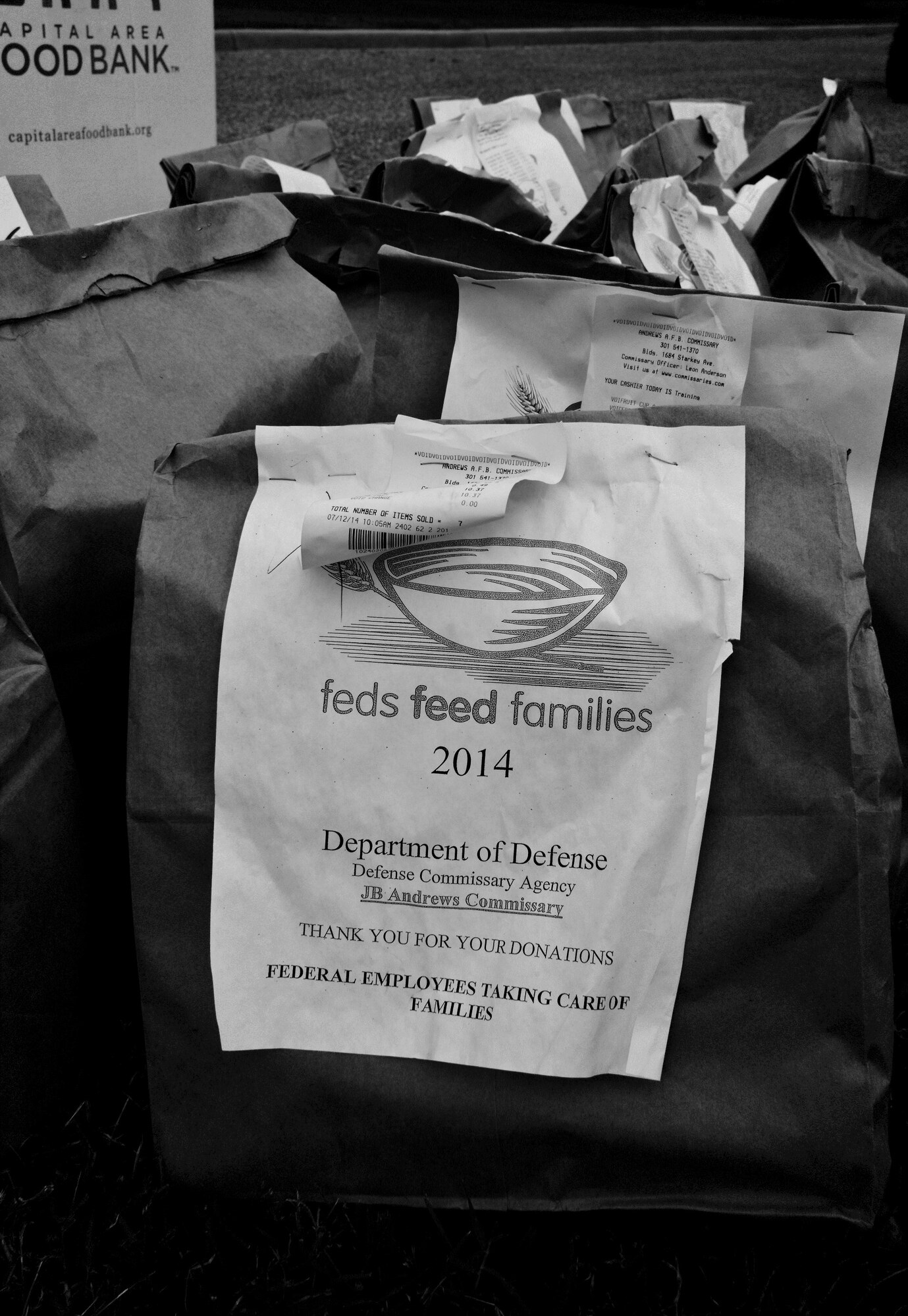 A food-filled bag sits, waiting to be loaded in a box and be picked up at the 89th Airlift Wing headquarters building at Joint Base Andrews, Md., Sept. 9, 2014. The food was collected by 89th AW members to support the Feds Feed Families campaign, a U.S. Department of Agriculture program. This food and 17 other boxes like it will be delivered to Waldorf to feed less-fortunate families in that area. (U.S. Air Force photo by Master Sgt. Kevin Wallace/RELEASED)