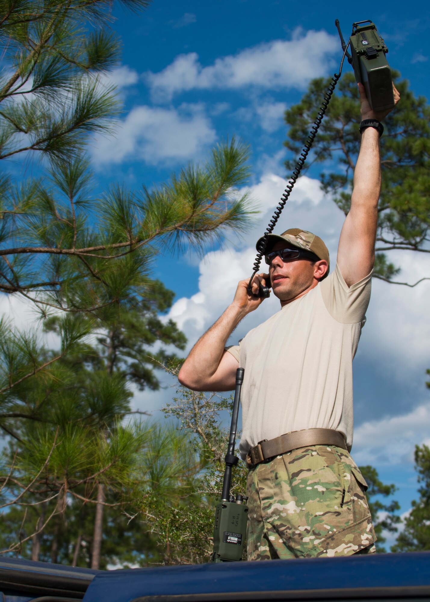 Senior Airman John Wilson, 919th Special Operations Communications Squadron, reaches for radio signal during a culmination exercise on the Eglin Air Force Base range, Aug. 27.  Duke Field’s reserve combat aviation advisors joined their active-duty counterparts for a five-day exercise of specialized spin-up training.  The Airmen move on to the Joint Readiness Training Center at Fort Polk, La., for further development. (U.S. Air Force photo/Tech. Sgt. Jasmin Taylor)