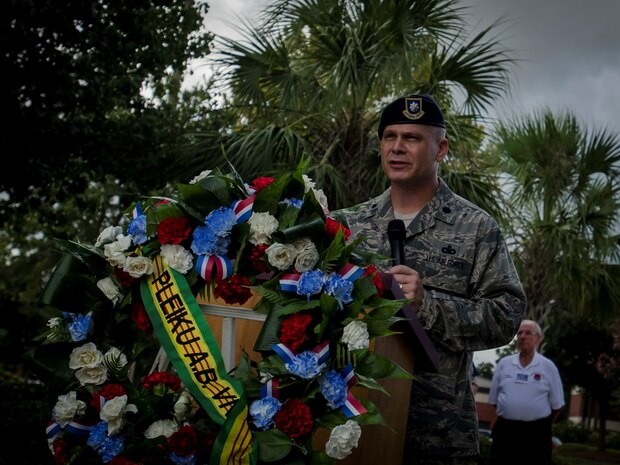 Lt. Col. Warren Brainard, 628th Air Base Wing Security Forces commander, speaks to members of the Pleiku Air Base Association wreath laying ceremony Sept. 5, 2014, at Joint Base Charleston, S.C. The members of the group met to lay a wreath and honor service members stationed at Pleiku Air Base, who were killed or missing in action during the Vietnam War. (U.S. Air Force photo / Senior Airman Tom Brading)