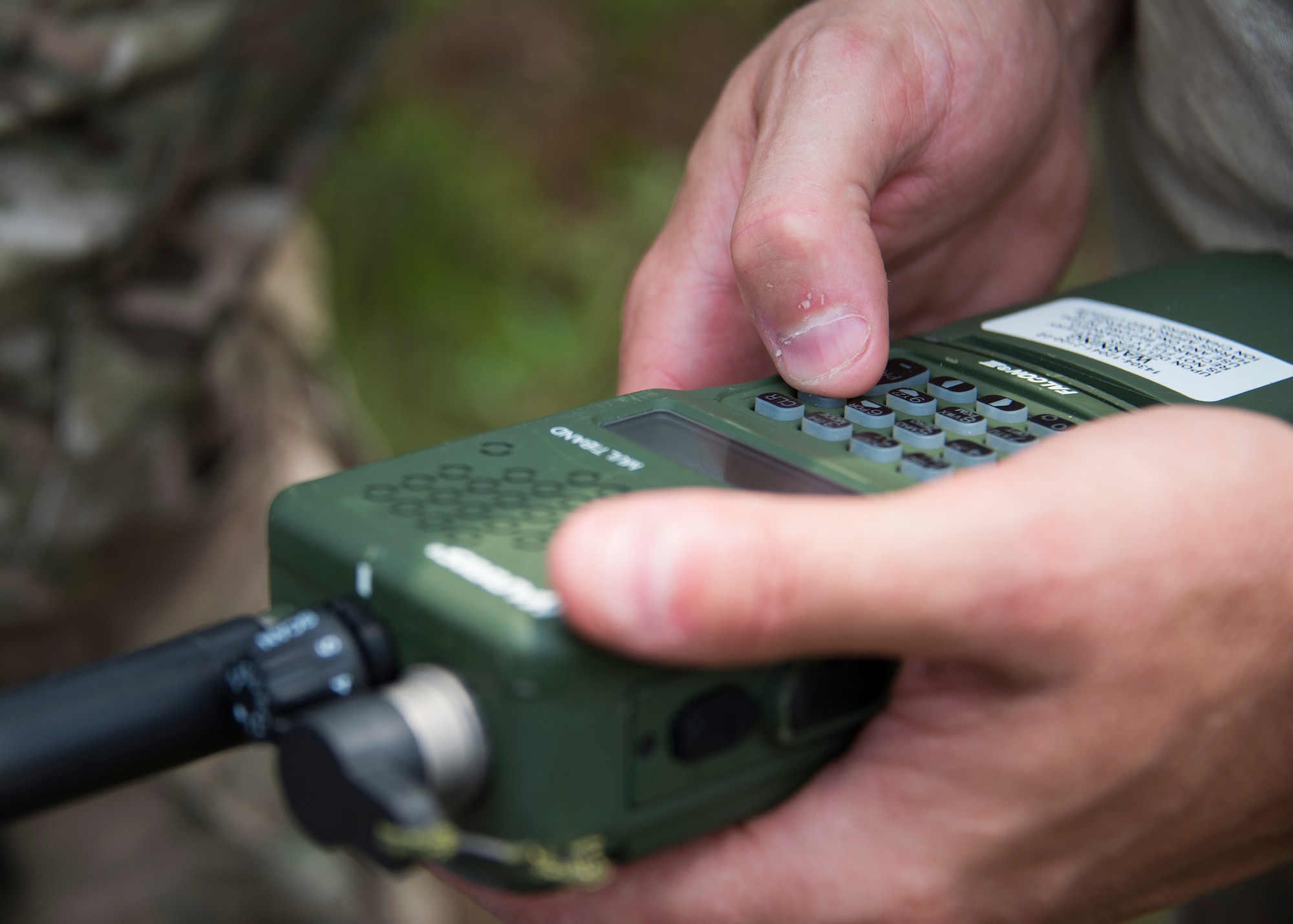 A radio is programmed in preparation for the last phase of the culmination exercise on the Eglin Air Force Base range, Aug. 27.  Duke Field’s reserve combat aviation advisors joined their active-duty counterparts for a five-day exercise of specialized spin-up training.  The Airmen move on to the Joint Readiness Training Center at Fort Polk, La., for further development. (U.S. Air Force photo/Tech. Sgt. Jasmin Taylor)