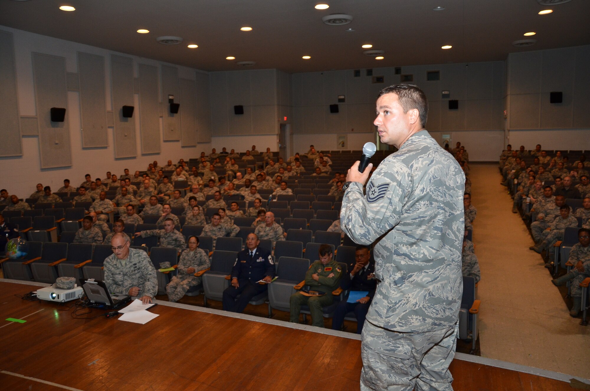 Tech. Sgt. Noel Moniz, a mental health services helper with the 624th Civil Engineering Squadron, gives Drug and Alcohol Abuse Prevention and Treatment training to the more than 400 Air Force reservists at a quarterly commander's call during the unit's monthly unit training assembly (UTA), Hickam Memorial Theater, Joint Base Pearl Harbor-Hickam, Hawaii, Sept. 8, 2014. UTAs are held one weekend a month for the sole purpose of keeping reservists trained and ready to deploy to serve our nation's needs at home and abroad. (U.S. Air Force photo by Tech. Sgt. Phyllis Keith)