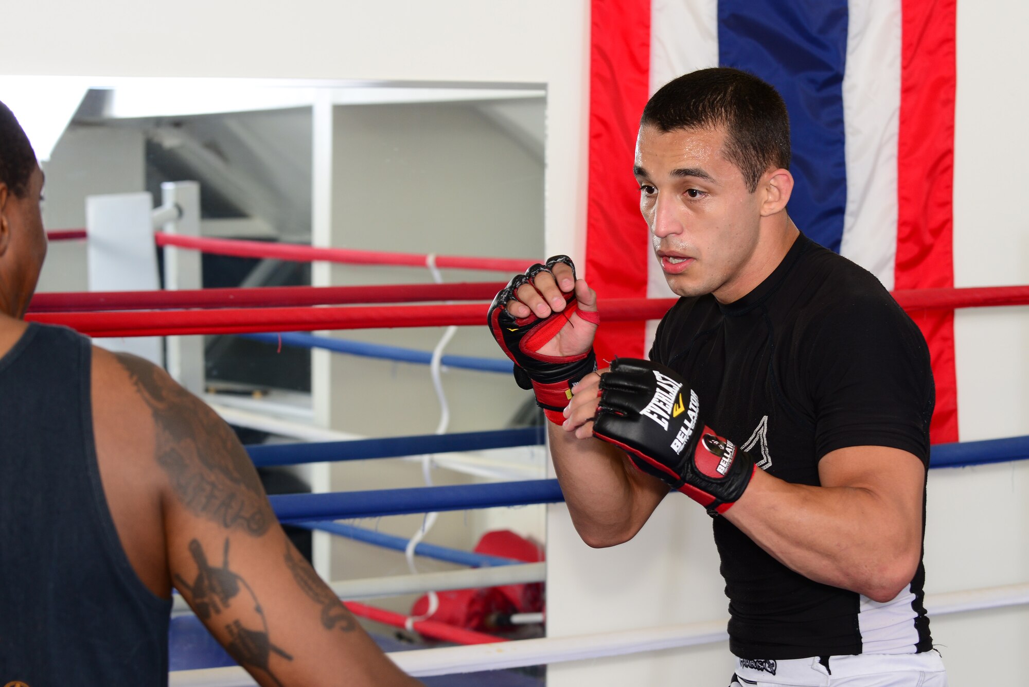 U.S. Air Force Airman 1st Class Juston Campos, 36th Intelligence Squadron target development analyst, spars with his mixed martial arts instructor at a martial arts academy in Newport News, Va., Sep. 8, 2014. Campos often spends two to three hours after work practicing Muay Thai eastern kickboxing and combat submission wrestling. (U.S. Air Force photo by Airman 1st Class Devin Scott Michaels)(This photo was cropped to emphasize the subject)