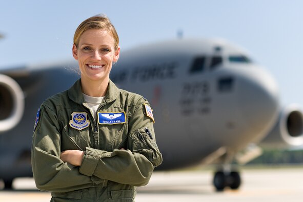 First Lt. Molly Frank, 3rd Airlift Squadron C-17 Globemaster III pilot, poses for a photo on the flight line Sept. 4, 2014, at Dover Air Force Base, Del. Frank also performs executive officer duties for the squadron and was randomly selected for The Airlifter's feature "A face of Team Dover: Vol. 1, No. 3." (U.S. Air Force photo by Roland Balik)