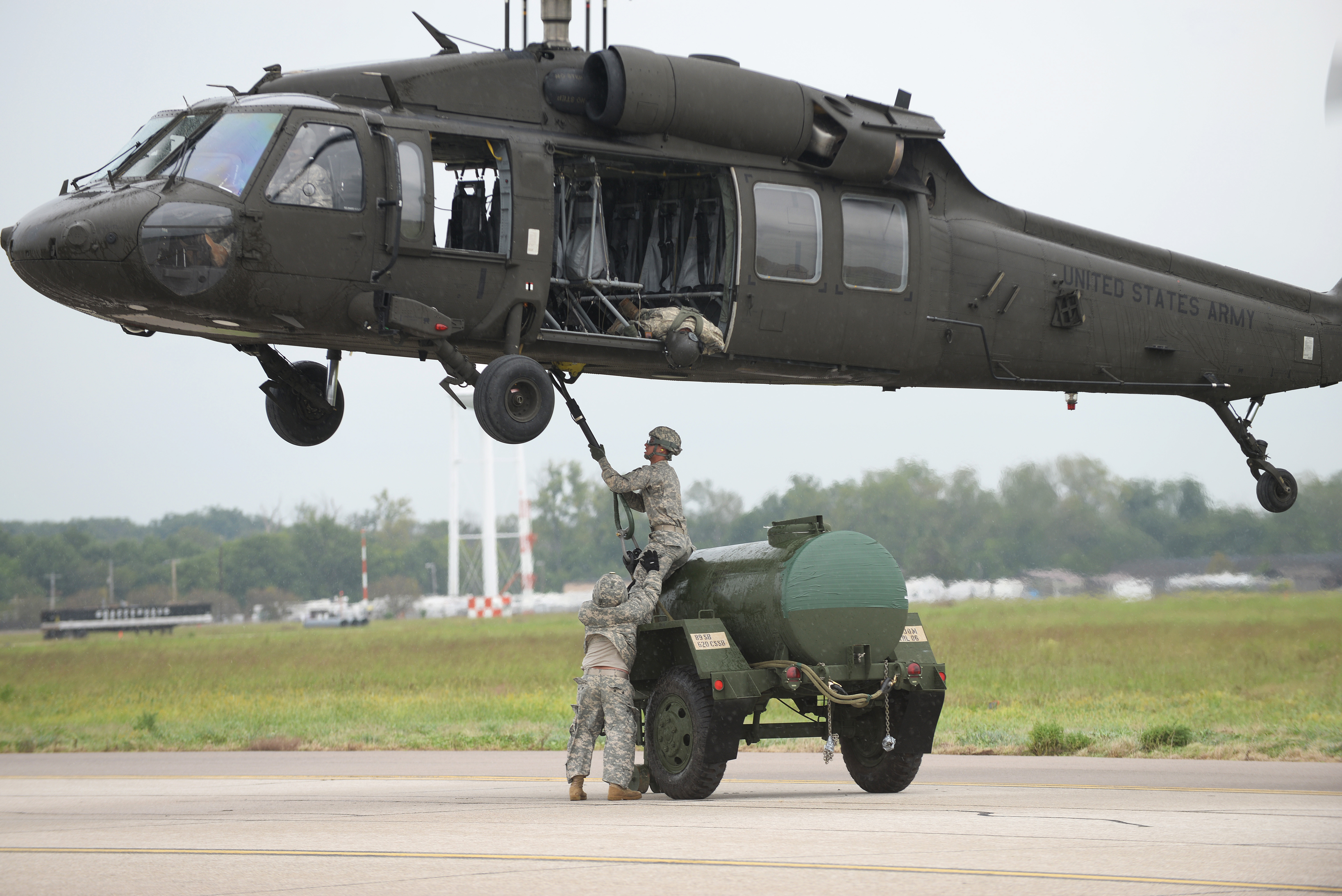 High Intensity Training Members of various agencies practice 'sling loading' heavy equipment