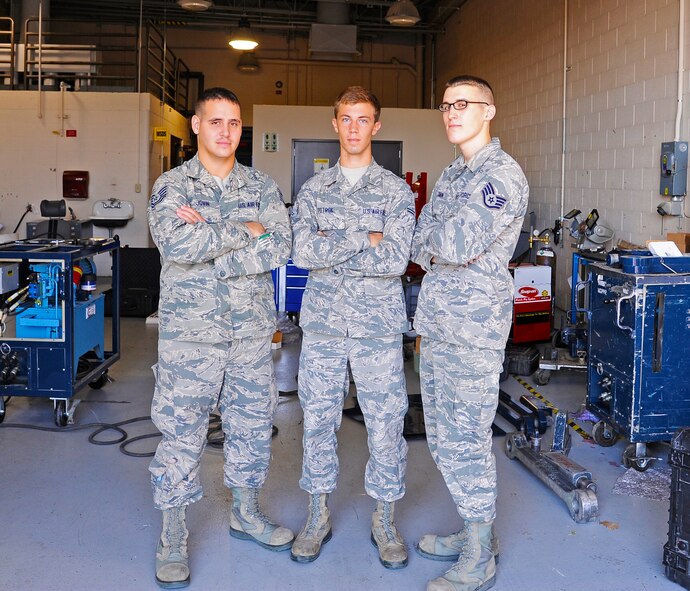 (From left to right) Tech. Sgt. Robert Jovin, Airman 1st Class Marcus Potrok, and Staff Sgt. Matthew Tobin, 341st Maintenance Operations Squadron mechanical and pneudraulics section team pose for a photograph after a training session at Malmstrom Air Force Base Aug. 19. The team is one of nine from the Base that will be competing in the 2014 Air Force Global Strike Challenge. (U.S. Air Force photo/Airman 1st Class Collin Schmidt)