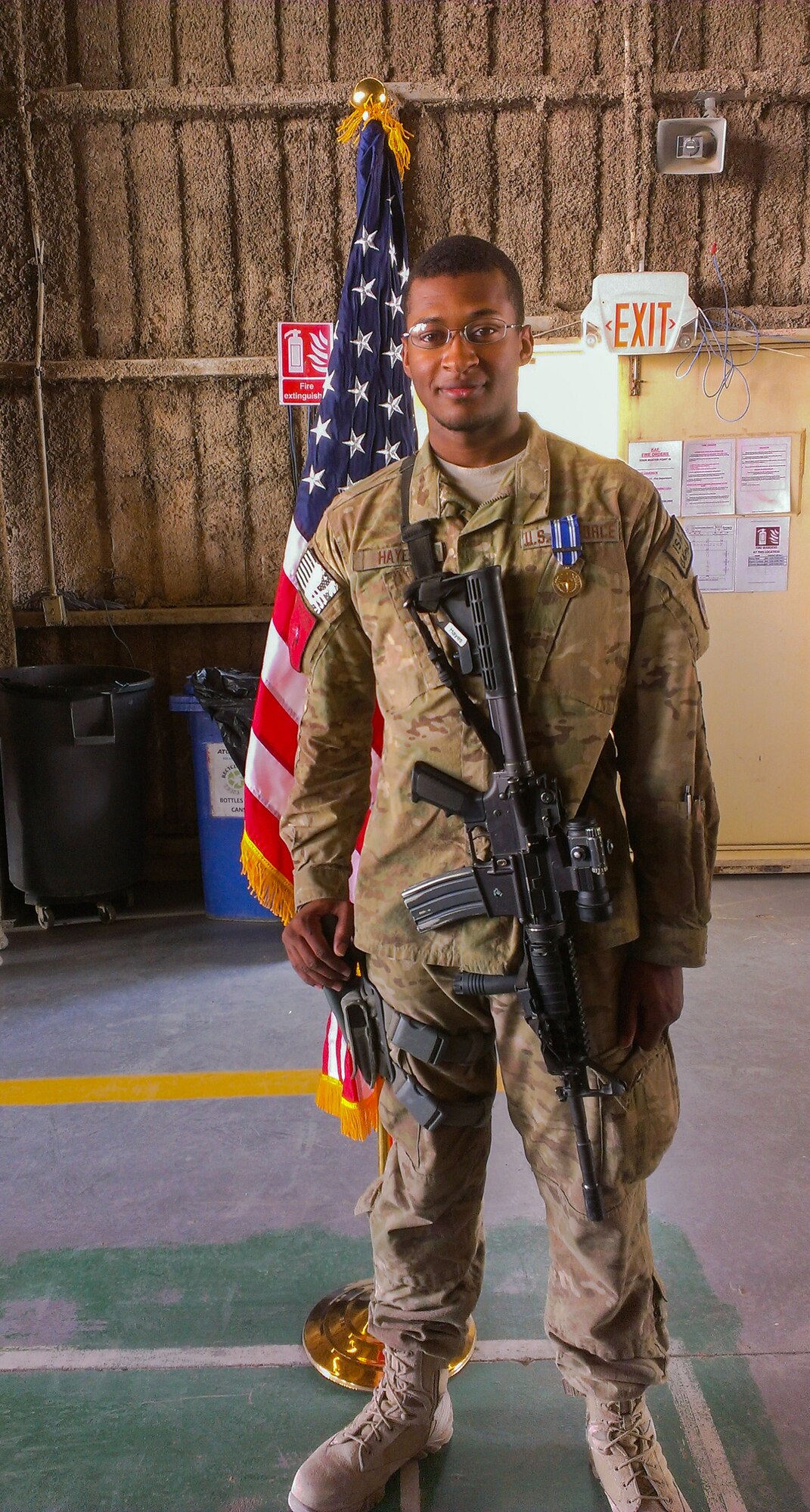 Senior Airman Alten Hayes poses for a photo during his deployment to Kandahar, Afghanistan. A rocket landed 60 feet away from his position but did not activate. (Courtesy photo)