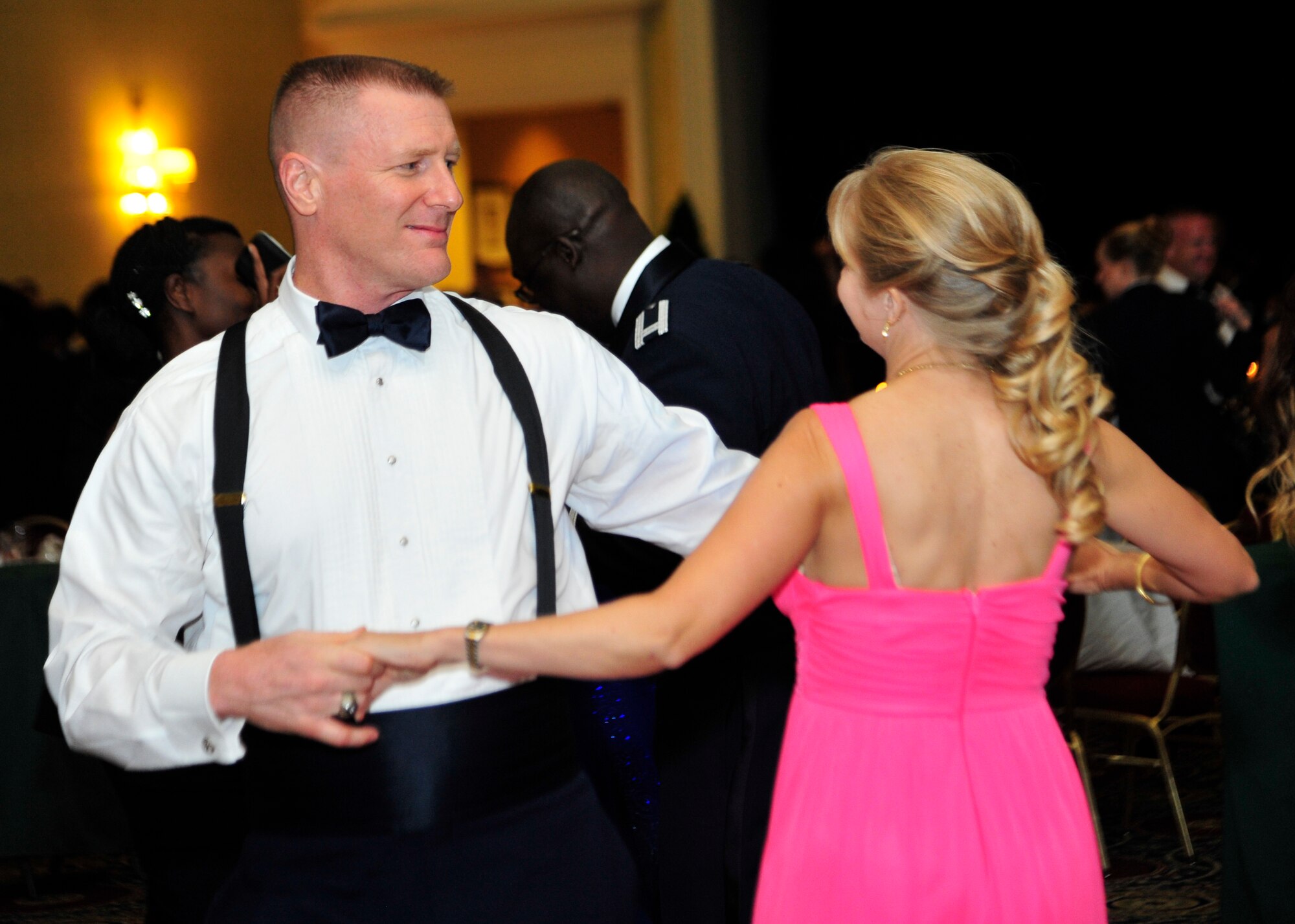 Col Michael Grismer, 436th Airlift Wing commander dances with his wife, Dr. Linda Grismer, at the 67th Air Force Ball Sept. 6, 2014, at Dover Downs in Dover, Del. Members of Team Dover stormed the dance floor to dance and celebrate at the end of the formal ceremony. (U.S. Air Force photo/Airman 1st Class William Johnson)