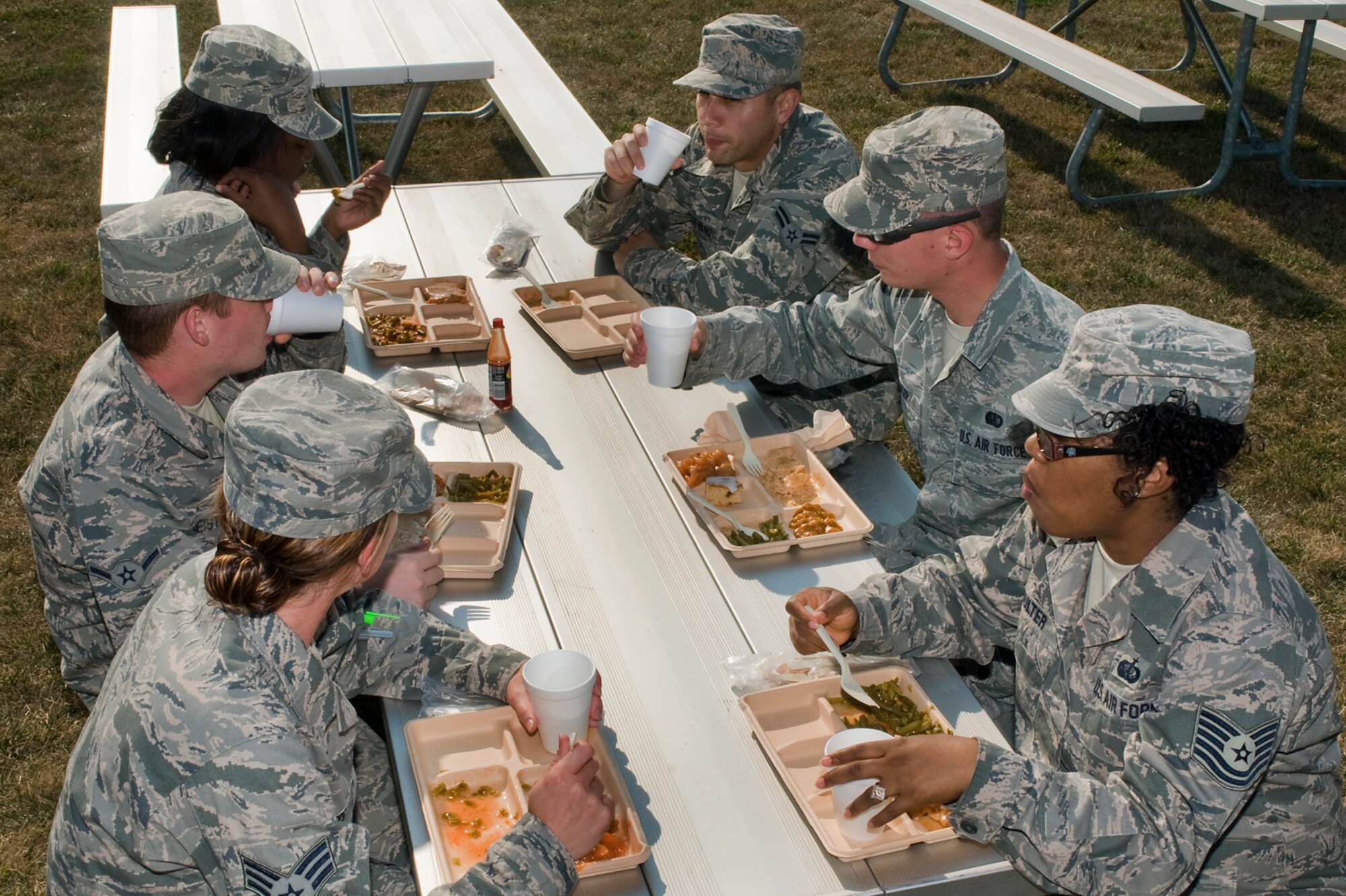 Airmen from the 434th Force Support Squadron enjoy the fruits of their labor after they set up a single palletized expeditionary kitchen, or SPEK, as part of their annual field training Aug. 8. The training provided the Airmen with skills useful in a deployed environment. (U.S. Air Force photo/Senior Airman Jami K. Lancette)