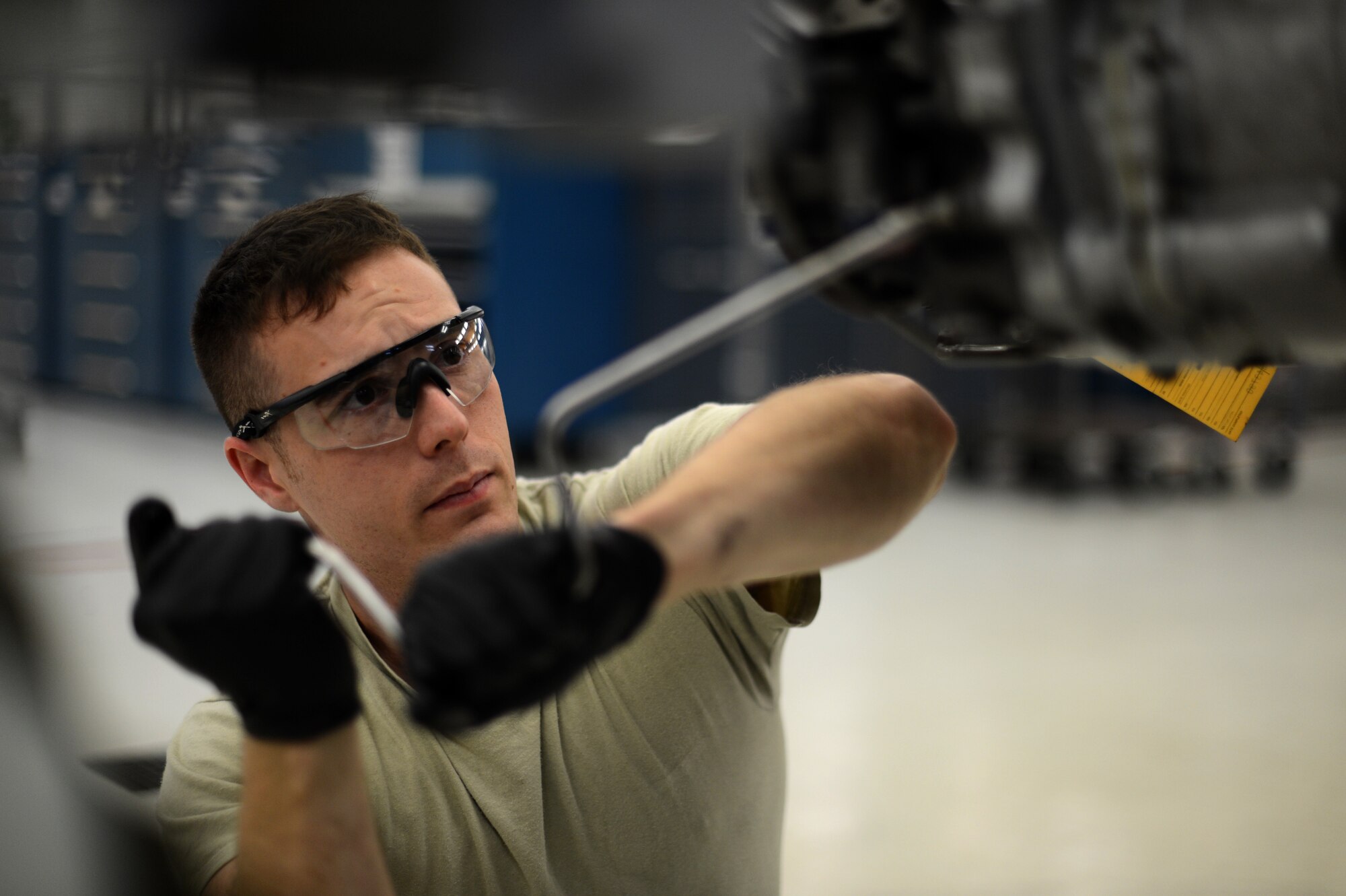 U.S. Air Force Staff Sgt. Willis Jensen, a 52nd Component Maintenance Squadron propulsion technician and native of Dana Point, Calif., loosens a bolt on an F-16 Fighting Falcon fighter aircraft engine pump Sept. 9, 2014. If Airmen find an engine’s oil sample has a certain level of metal residue running throughout its parts, they must remove and replace the metal bearings responsible. (U.S. Air Force photo by Senior Airman Gustavo Castillo/Released)