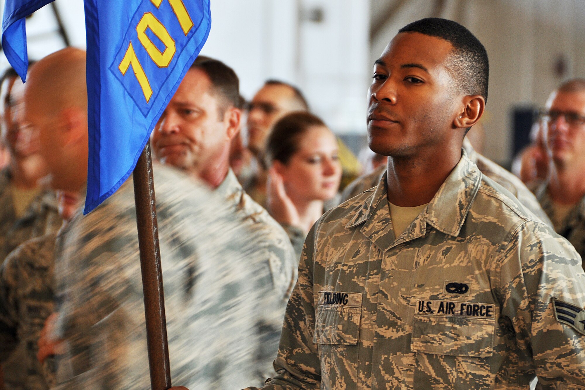 U.S. Air Force Senior Airman Dequences Fielding holds the 707th Maintenance Squadron guidon during a 307th Maintenance Group commander’s call, Sept. 6, 2014, Barksdale Air Force Base, La. The event was held during the 307th Bomb Wing’s Unit Training Assembly and gives commanders an opportunity to brief their Airmen and recognized those for outstanding achievement in their duties. (U.S. Air Force photo by Master Sgt. Mary Hinson/Released)