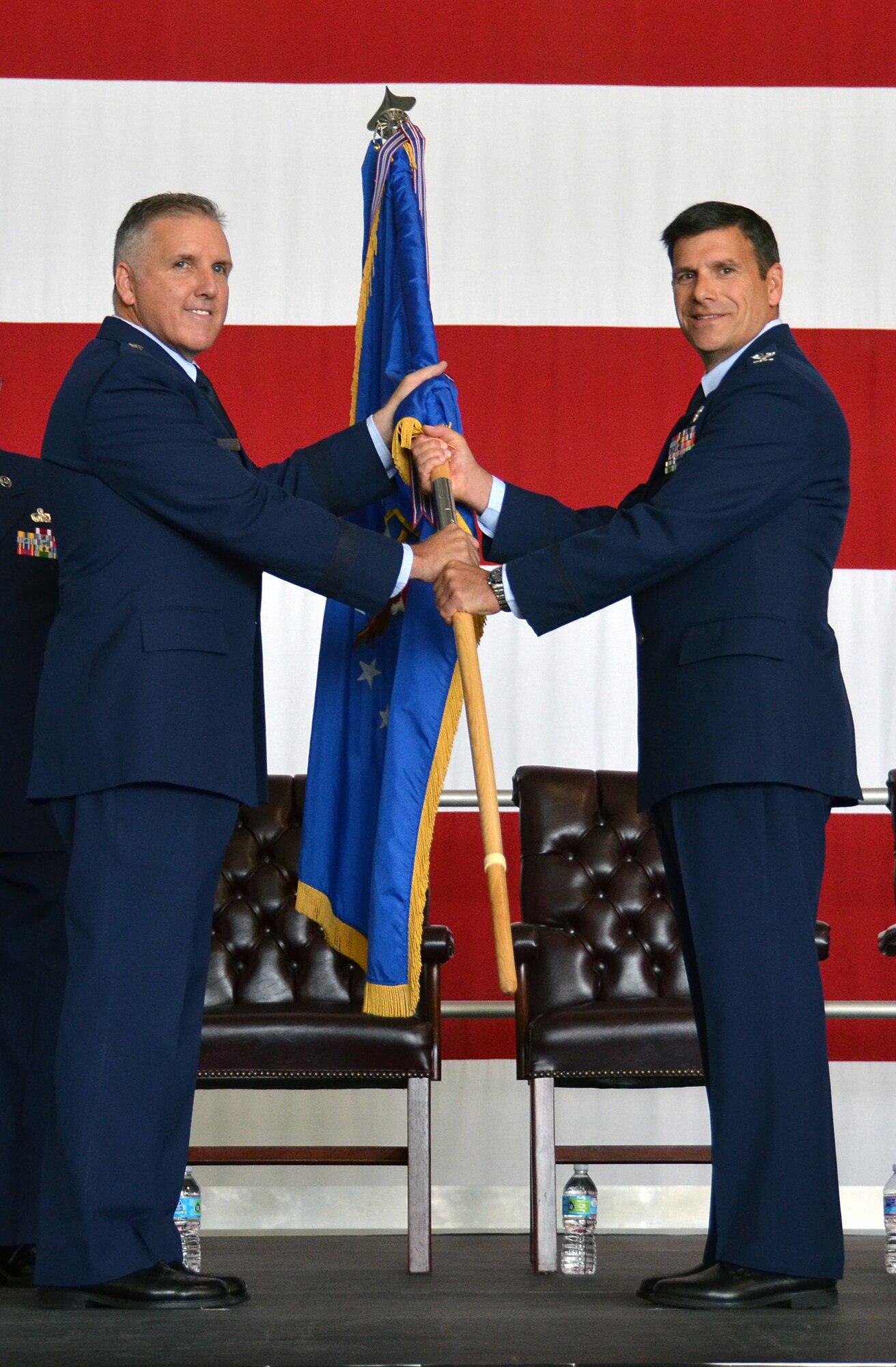 Col. Albert Lupenski (right) accepts the 439th Airlift Wing's guidon from Brig. Gen. John Flournoy (left), 4th Air Force Commander, during the wing Change of Command ceremony inside the Base Hangar at Westover Air Reserve Base, Mass., Sept. 7, 2014. (U.S. Air Force photo/SSgt. Kelly Goonan)