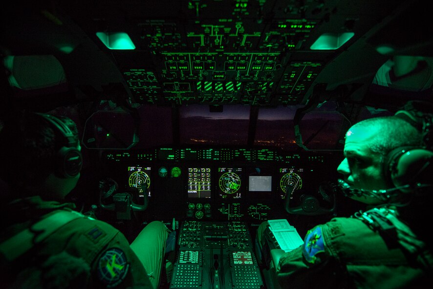 U.S. Air Force Maj. Eric Lipp, right, and Capt. Maxwell Miller, both 71st Rescue Squadron HC-130J Combat King II pilots, fly an HC-130J Combat King II during an aerial refueling mission over Tennessee, Sept. 4, 2014. The HC-130J is the Air Force’s newest dedicated, fixed-wing personnel recovery platform and is tasked to perform airdrop, helicopter air-to-air refueling, humanitarian assistance and aeromedical evacuations. (U.S. Air Force photo by Airman 1st Class Ryan Callaghan/Released)