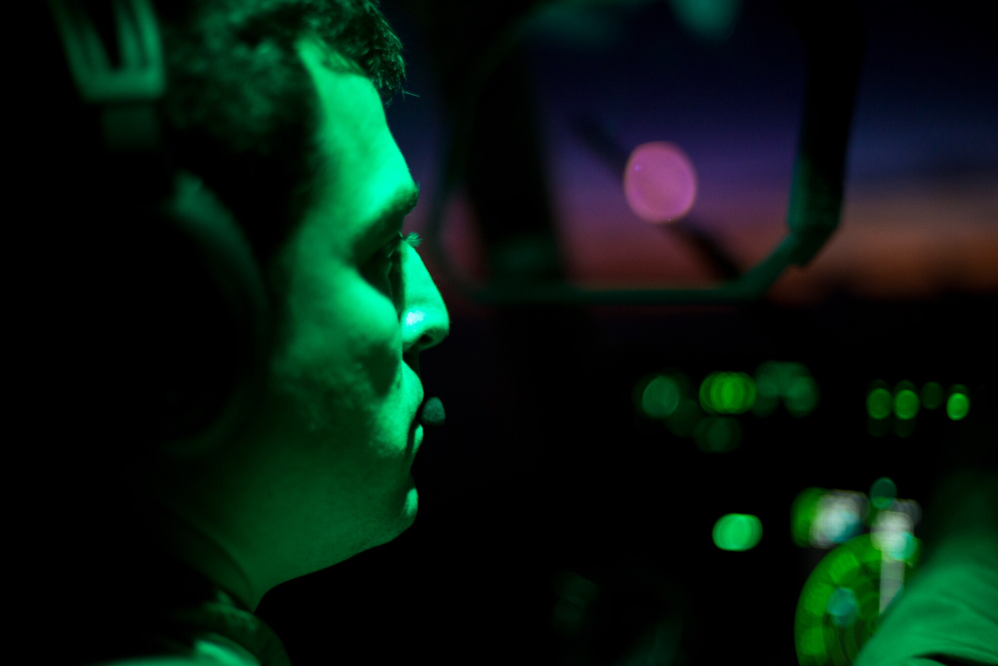 U.S. Air Force Capt. Maxwell Miller, 71st Rescue Squadron HC-130J Combat King II pilot, checks a flight instrument during an aerial refueling mission over Tennessee, Sept. 4, 2014. The HC-130J relies on refueling aircraft, such as the KC-135 Stratotanker, to complete long-distance missions. (U.S. Air Force photo by Airman 1st Class Ryan Callaghan/Released)