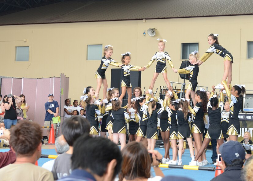 The Yokota All-Stars perform a cheerleading routine at the Japanese-American Friendship Festival at Yokota Air Base, Japan, Sept. 7, 2014. More than 148,000 people attended the two-day event which featured music, dancing and performances from both Japanese and American cultures. (U.S. Air Force photo by Airman 1st Class David C. Danford/Released)