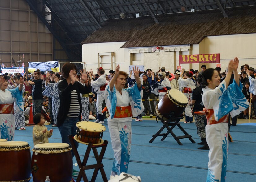The Tanabata Dancers invite festival goers to join in a traditional Japanese dance, at the Japanese-American Friendship Festival at Yokota Air Base, Japan, Sept. 7, 2014. More than 148,000 people attended the festival which included a military aircraft display, an array of food booths and multicultural entertainment. (U.S. Air Force photo by Airman 1st Class David C. Danford/Released)