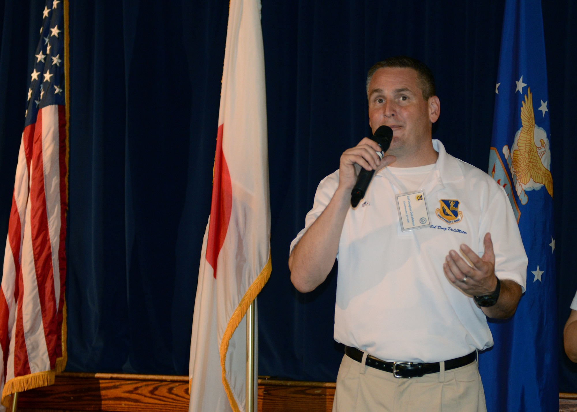 Col. Douglas DeLaMater, 374th Airlift Wing commander, welcomes local community leaders to the Japanese-American Friendship Festival reception at Yokota Air Base, Japan, Sept. 6, 2014. Yokota, with an average populace of 11,000 people, hosted more than 148,000 during the two-day celebration. (U.S. Air Force photo by Airman 1st Class David C. Danford/Released)
