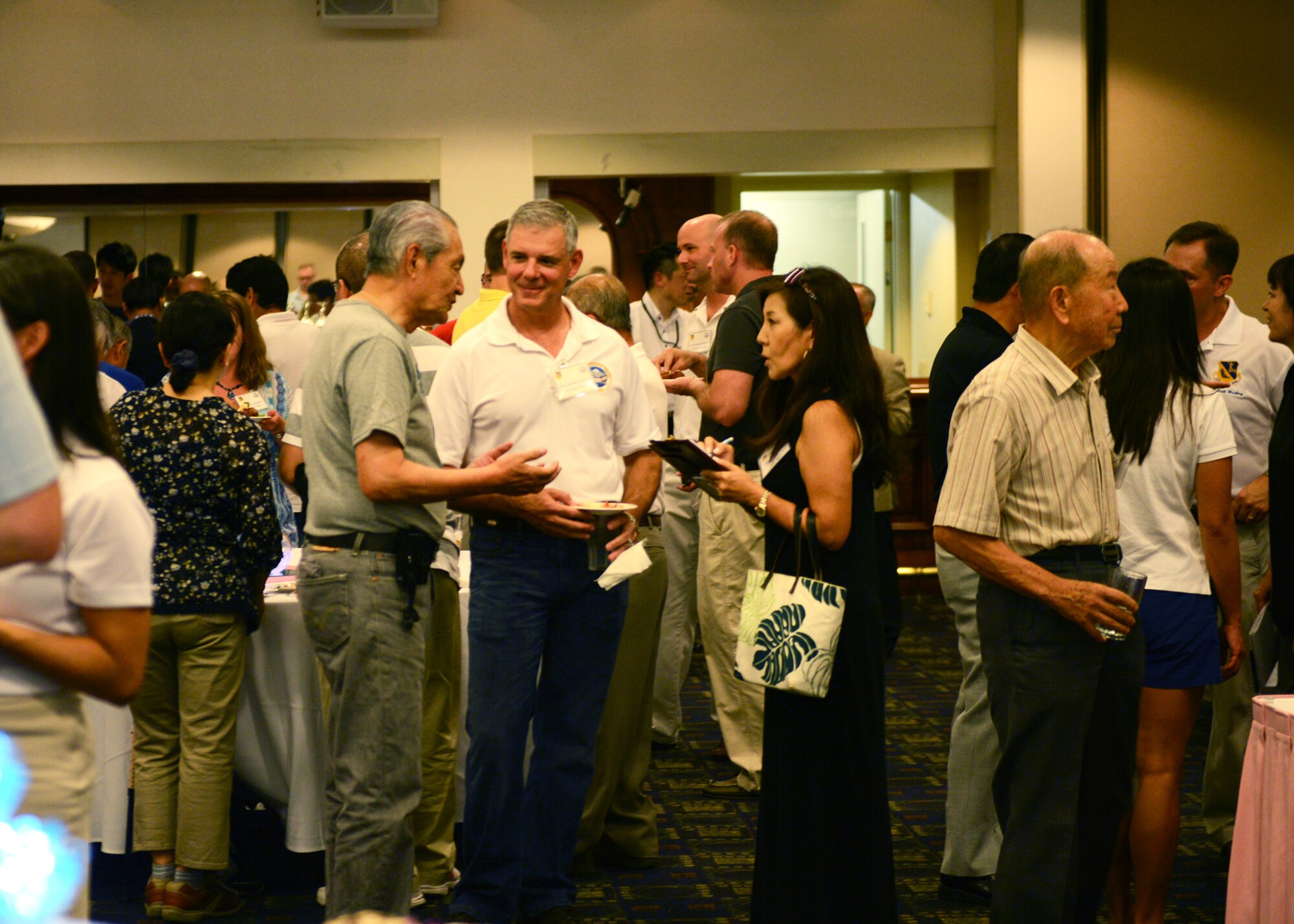 Lt. Gen. Salvatore Angelella, U.S. Forces Japan, and 5th Air Force commander, speaks with local leaders at Yokota Air Base, Japan, Sept. 6, 2014. The Japanese-American Friendship Festival celebrates the bonds of friendship between U.S. Forces and the Japan through cultural exchange. (U.S. Air Force photo by Airman 1st Class David C. Danford/Released)