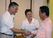 Col. Douglas DeLaMater, 374th Airlift Wing commander, greets Fumioki Hirahata, Akishima-Yokota Friendship Club president, at Yokota Air Base, Japan, Sept. 6, 2014. A reception was held at the enlisted club and was attended by members of wing leadership and local community leaders. (U.S. Air Force photo by Airman 1st Class David C. Danford/Released)