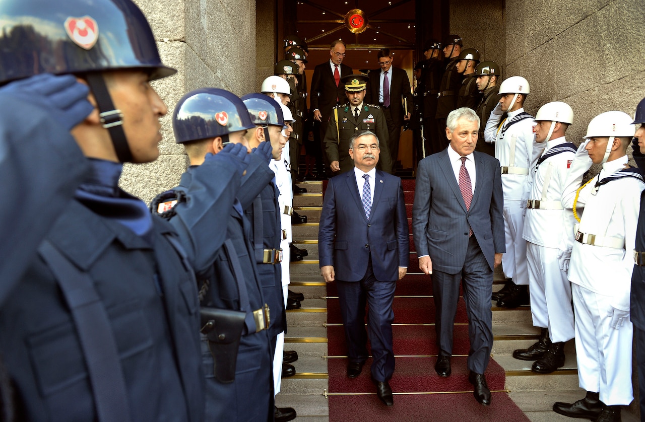 Turkish Defense Minister Ismet Yilmaz escorts Defense Secretary Chuck Hagel after their meeting at the Ministry of National Defense in Ankara, Turkey, Sept. 8, 2014. DoD photo by Glenn Fawcett
