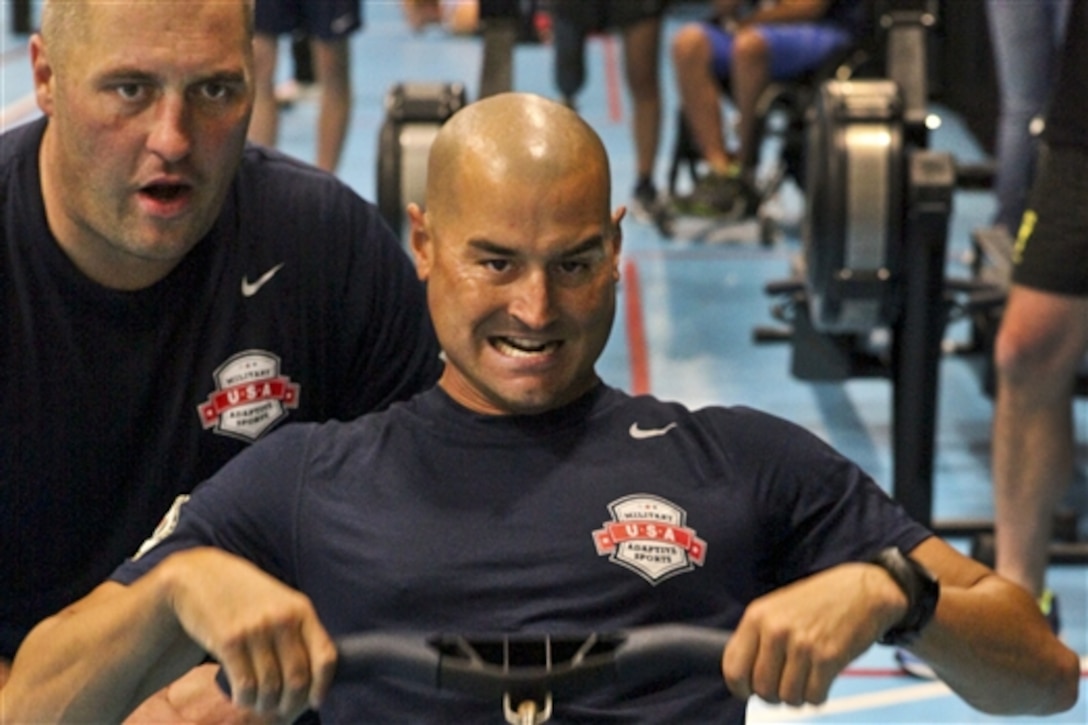 U.S. Marine Corps Gunnery Sgt. Matt Hammond participates in an indoor rowing session during the first day of practice for the 2014 Invictus Games in London, Sept. 8, 2014. Twenty wounded, ill or injured Marines from the Wounded Warrior Regiment are competing for the U.S. Team during the international games. U.S. Team members will train for three days before the competition.