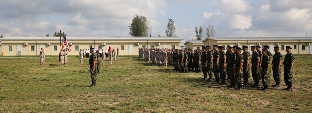 U.S Marines of 3rd Battalion, 8th Marine Regiment, 2nd Marine Division and 2nd Battalion, 2nd Marine Regiment, 2nd Marine Division held a ceremony to mark the turnover of a new iteration of Black Sea Rotational Force on Mihail Kogalniceanu Air Base, Romania, Aug. 21, 2014. 2/2 will be taking 3/8’s place for the winter rotation of BSRF. (U.S. Marine Corps photo by Lance Cpl. Ryan Young/released)