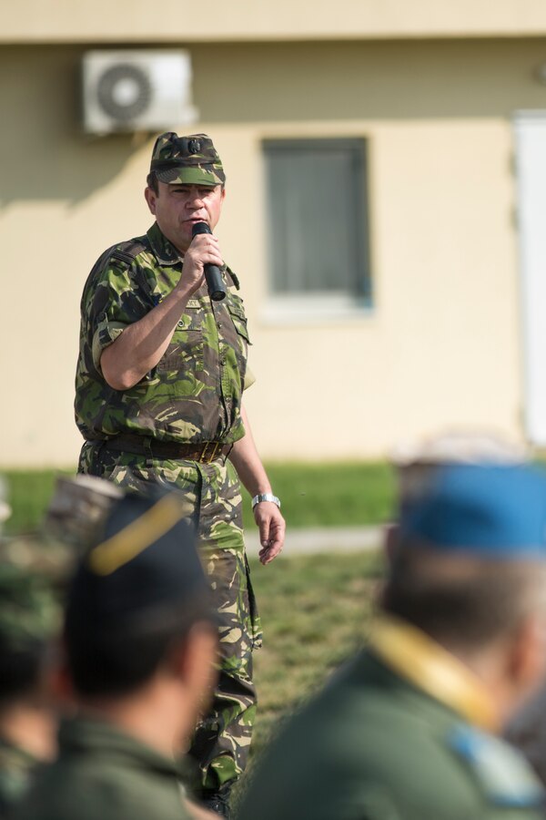 U.S. Marines of 3rd Battalion, 8th Marine Regiment (3/8), 2nd Marine Division (Mar Div), and 2nd Battalion, 2nd Marine Regiment (2/2), 2nd Mar Div, hold a ceremony to mark the closing of Black Sea Rotational Force (BSRF), 14.2 and the opening of BSRF 14.2A on Mihail Kogalniceanu Air Base, Aug. 21, 2014. 2/2 will replaced 3/8 for the winter rotation of BSRF. (U.S. Marine Corps photo by Cpl. Alexandria Blanche, 2nd MAR DIV, Combat Camera/Released)