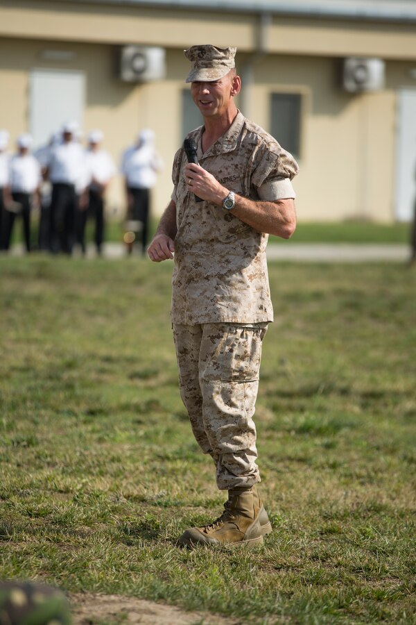 U.S. Marines of 3rd Battalion, 8th Marine Regiment (3/8), 2nd Marine Division (Mar Div), and 2nd Battalion, 2nd Marine Regiment (2/2), 2nd Mar Div, hold a ceremony to mark the closing of Black Sea Rotational Force (BSRF), 14.2 and the opening of BSRF 14.2A on Mihail Kogalniceanu Air Base, Aug. 21, 2014. 2/2 will replaced 3/8 for the winter rotation of BSRF. (U.S. Marine Corps photo by Cpl. Alexandria Blanche, 2nd MAR DIV, Combat Camera/Released)