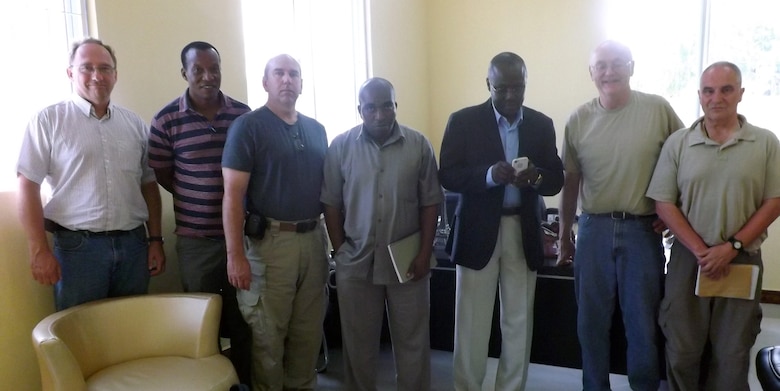 Members of the Tanzania Market Access Roads Project from the United States meet with high level officials in the First Vice President Office in Zanzibar. They are from left, Danny Klima, project manager, Cosmas Masolwa, chief maintenance engineer, Gordon Lewis, soil engineer, Ali Vuai Pander, assistant EIA, Sheha Mjaja Juma, director of environment, David Ray, team leader and Patrick Chauvey, environmental specialist. 