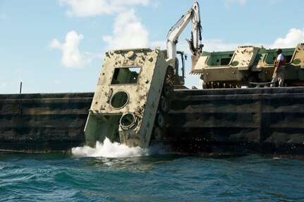 The South Carolina Army National Guard and Department of Natural Resources dropped 36 vehicles into the water off the coast of Beaufort, S.C., Sept. 4, 2014, to help form the manmade reefs that attract sea life and tourism to the area. 