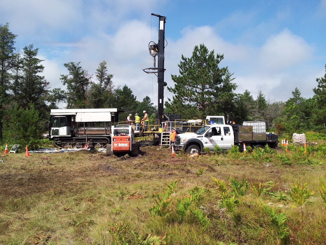 Contractors use a track-mounted rotosonic drill rig to install monitoring wells at the Raco Army Airfield and Missile Site, in the Hiawatha National Forest in Michigan as part of the ongoing environmental remedial investigation.