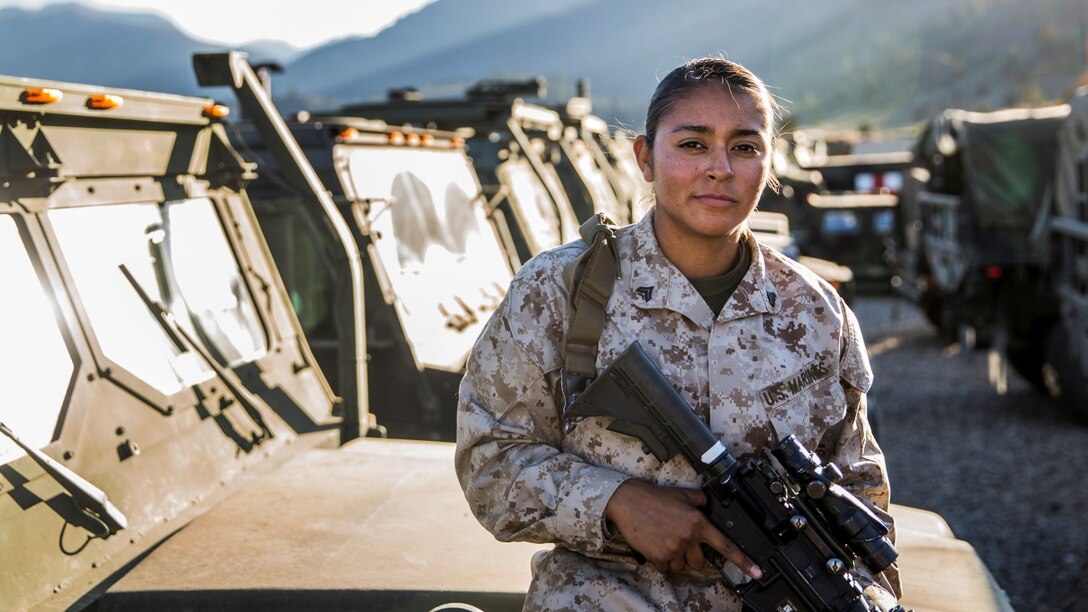 U.S. Marine Cpl. Monica M. Coleman conducts maintenance quality checks on her Medium Tactical Vehicle Replacement aboard Marine Corps Warfare Training Center in Bridgeport, Calif., on Sept. 6, 2014. Coleman, 20, is from San Antonio, and is a motor transportation operator with Headquarters and Service Battalion, 1st Marine Regiment. (U.S. Marine Corps photo by Sgt. Emmanuel Ramos/Released)