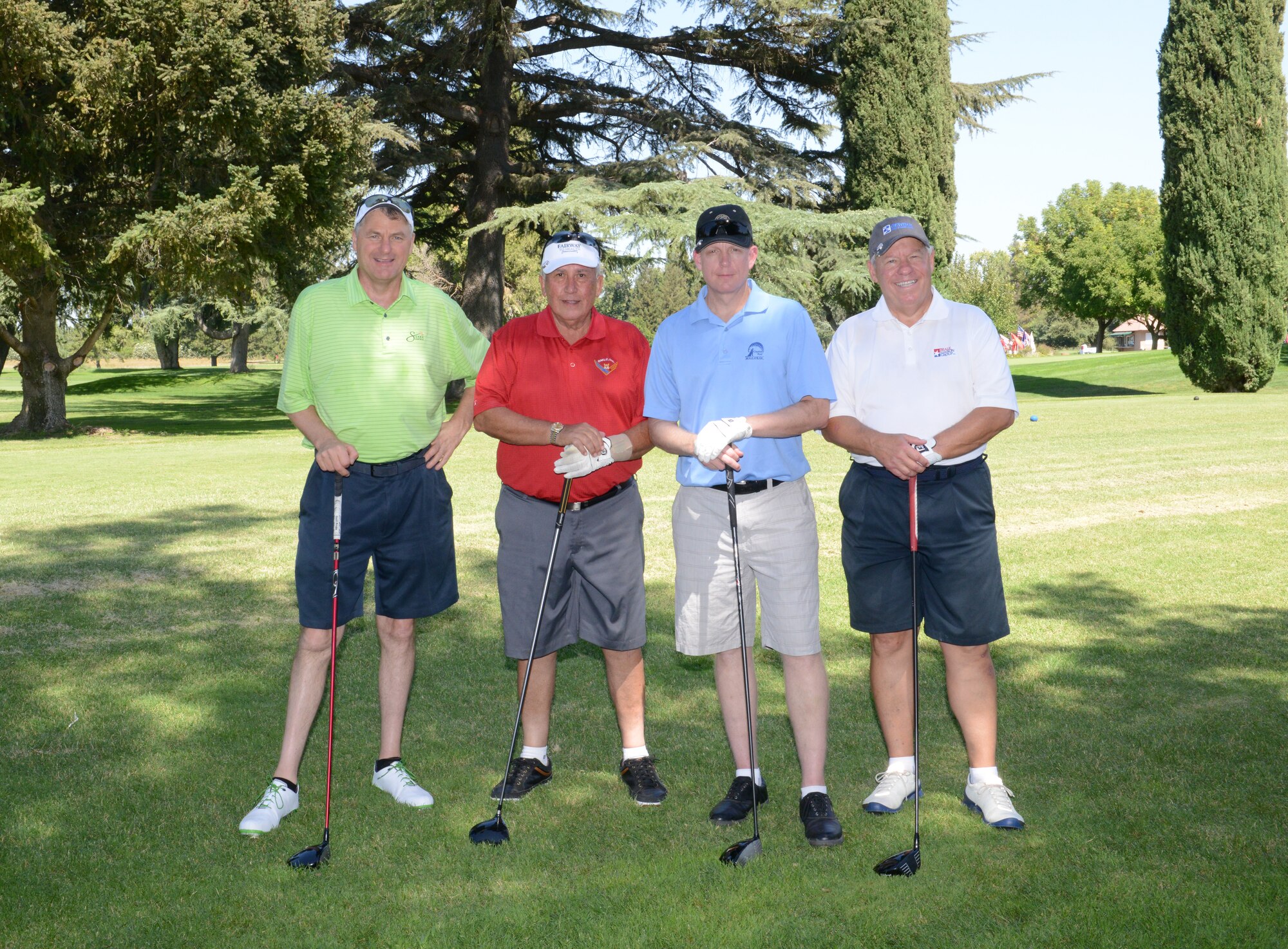 Col. Douglas Lee (center-right), 9th Reconnaissance Wing commander, takes a photo with members of the Beale Military Liaison Committee during a golf tournament held at a local golf course Sept. 5, 2014. The event raised more than $80,000 for quality of life projects benefitting Beale Airmen and their families. (U.S. Air Force photo by John Schwab/Released)